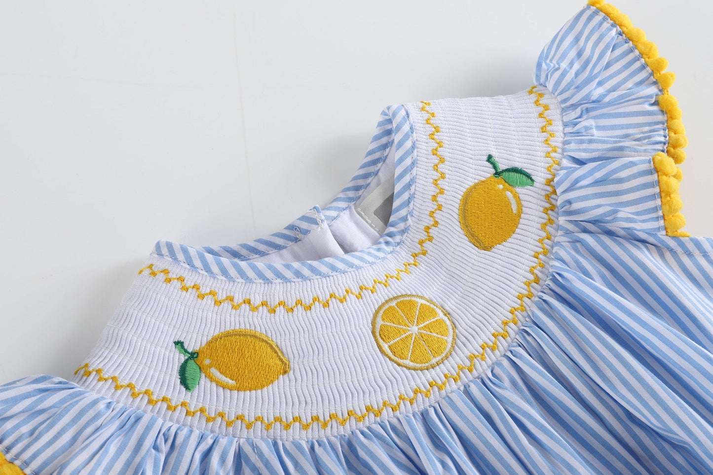 Light Blue Striped Lemons Smocked Ruffle Romper